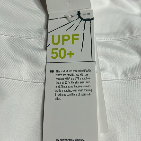 ADIDAS white skort with pleats on the bottom  half . Then two horizontal bands. - Picture 7 of 11